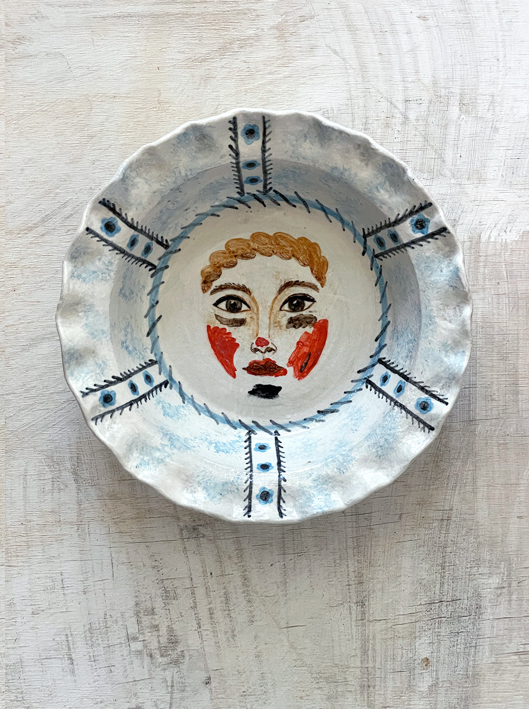 PIE DISH OF INEZ WITH FACE PAINT